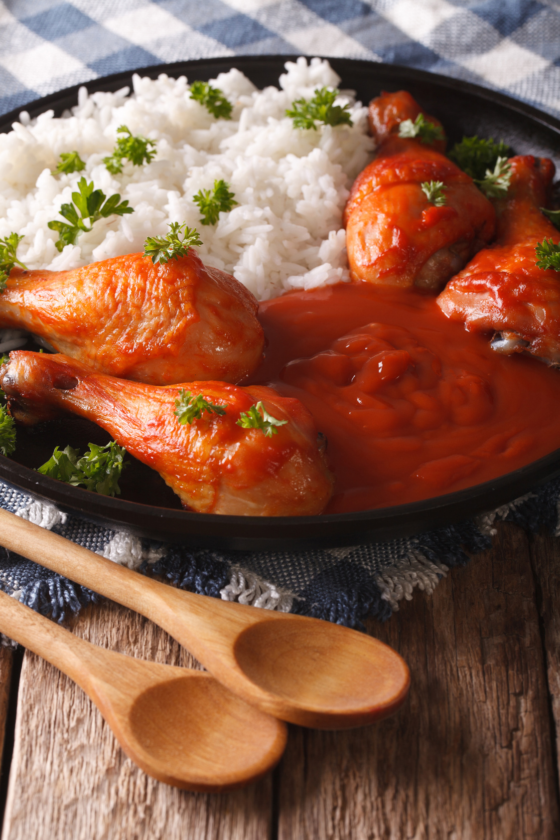 Chicken legs baked in spicy chilli sauce Sriracha and Rice